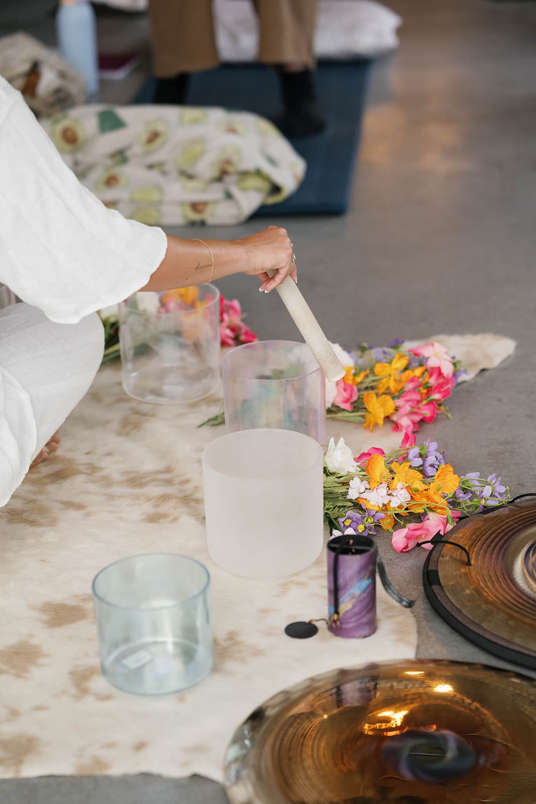 Laura preparing crystal bowls and fresh flowers before a gathering